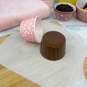 Removing chocolate cases from liners