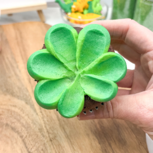 The complete green buttercream frill on a cupcake. Step 5.