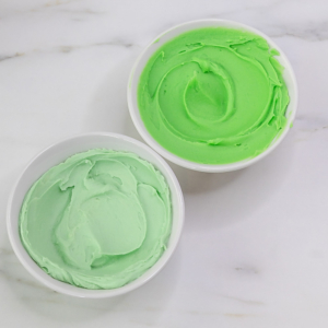 Two shades of green buttercream in bowls. Step 1.
