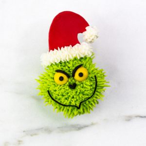 Close-up of a Grinch cupcake