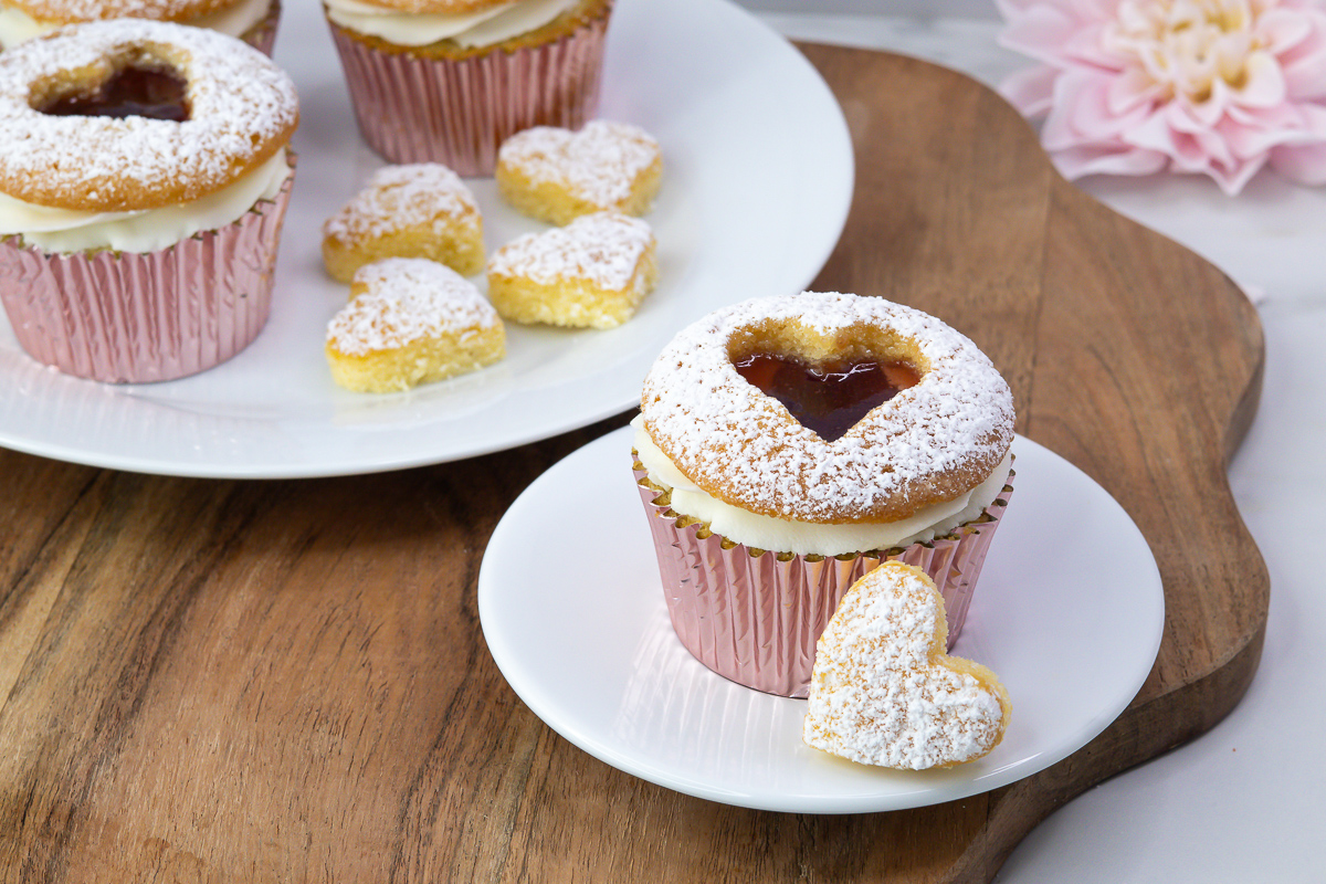 Finished Linzer cupcakes with raspberry jam centres and icing sugar dusting.